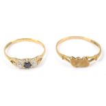 Two 9ct gold dress rings, comprising a 9ct gold heart twist ring, and a 9ct gold three stone set