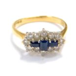An 18ct gold sapphire and diamond ring, set with baguette and brilliant cut sapphires in a