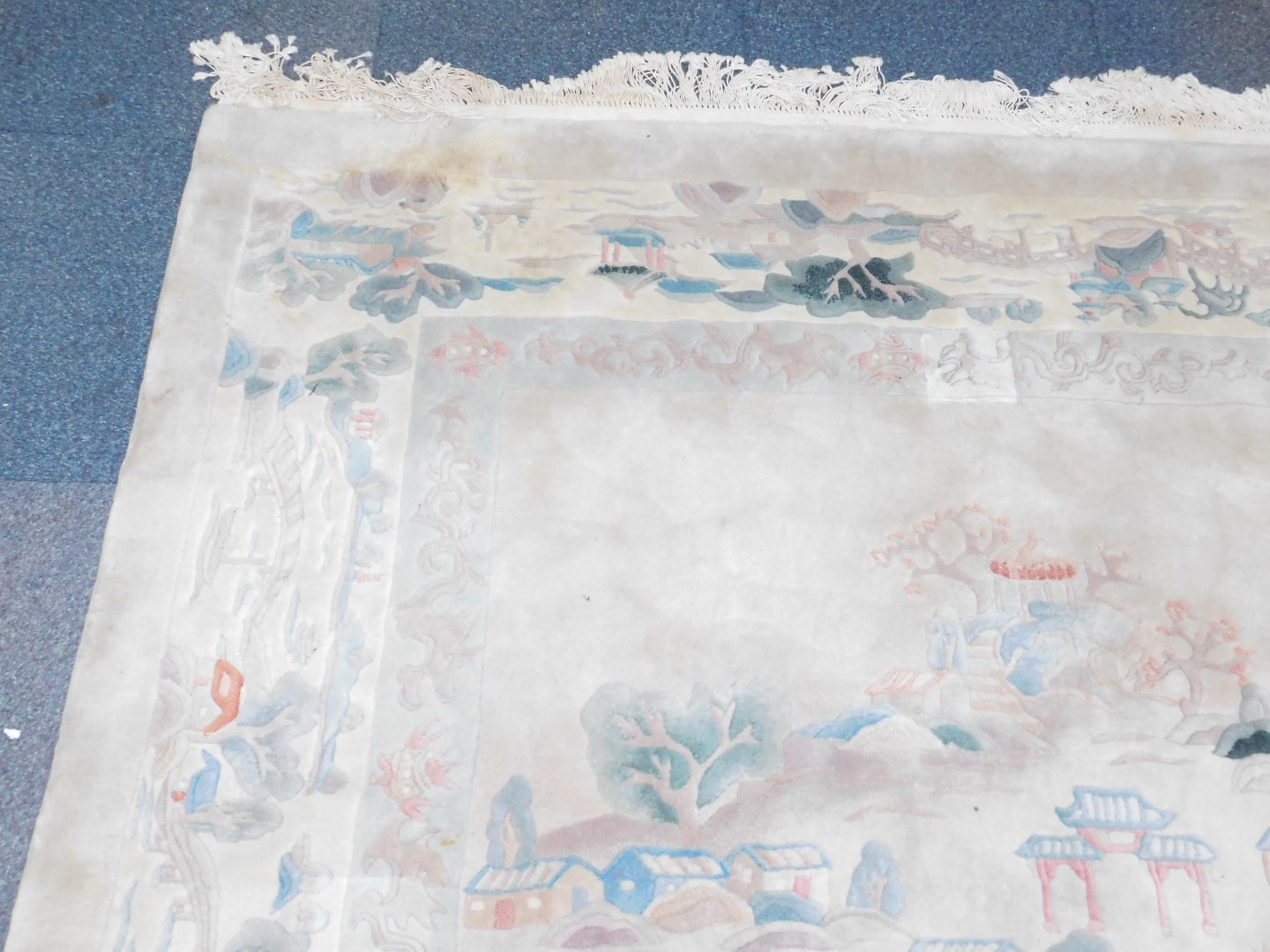 A Chinese rug decorated with a landscape, against a cream ground, 384cm x 275cm. - Image 2 of 3