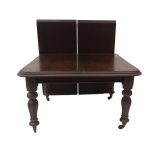 A Victorian mahogany extending dining table, with double moulded top, reeded baluster legs and brass