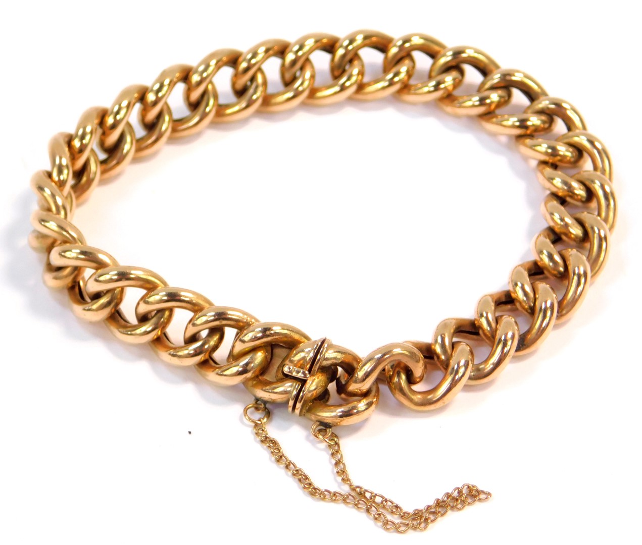 A 9ct gold curb link bracelet, on a snap clasp with safety chain as fitted, 19.2g.