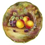 A Royal Worcester porcelain plate, decorated with fruit by J Skerrett, within gilt borders,