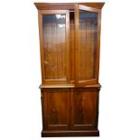 A Victorian mahogany bookcase, the top with two glazed doors, the base with two panel doors