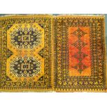 Two similar Turkish type small rugs or mats, each on an orange ground, 86cm x 65cm and 87cm x 63cm.