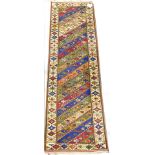 A Persian runner, with a multicolour stripe design, one wide and two narrow borders, 290cm x 90cm.