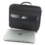 A Hewlett Packard touch smart laptop, 18" monitor in an Antler carry case.