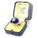 A late 19thC/early 20thC dress ring in George III style, with central oval blue enamel panel set