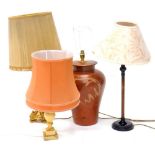 A collection of table lamps, to include a marble example, a bronzed base metal table lamp, a gilt