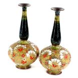 A pair of Doulton Lambeth Slaters patent bottle shaped vases, each decorated in red, gold and