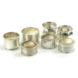 Various silver napkin rings, to include George V silver example of inverted form with lower raised