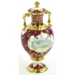 A Royal Crown Derby porcelain Harewood House vase and cover, decorated with a scene of the house, on