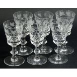 A set of six Edinburgh crystal glasses, each decorated with grape vines, with faceted bowls and a