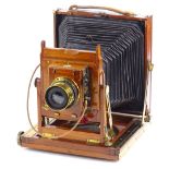 A Thornton Pickard mahogany and brass plate camera, with canvas bellows, the lens stamped Beck