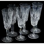 A set of six Waterford crystal champagne glasses, each in original fitted case.