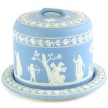 A late 19thC pale blue Jasperware cheese dome and cover, decorated with neo-classical ladies,