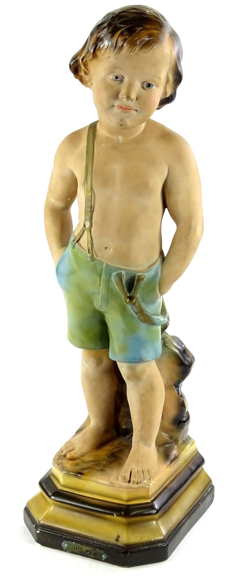 An Art Deco plaster model of a young boy, titled to the plaque Shy Boy, 60cm H.Provenance: The