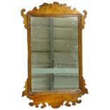 A photo frame wall mirror in mid 19thC style, with rectangular plate, moulded edge and shaped