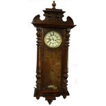 A late 19thC Gustav Becker Vienna wall clock, in a walnut case with shaped crest, Roman numerals