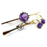 Two bar brooches and a pair of earrings, to include an amethyst and tiny diamond set bar brooch, the