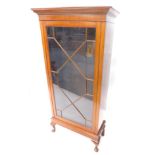 An Edwardian mahogany display cabinet, the top with a moulded cornice above a single astragal glazed