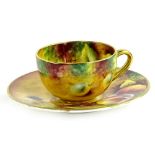 A Royal Worcester porcelain cup and saucer, painted with fruit by T Knott, printed mark in black