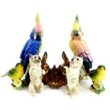 A collection of ceramic animals, to include two Karl Ens parrots, a Goebel group of three rabbits,