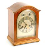 An early 20thC mahogany mantel clock, the silvered dial with subsidiary slow fast and chime silent