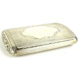 A Victorian silver snuff box, with engine turned decoration, the hinged lid with a vacant cartouche,