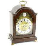 An Elliott mantel clock in George III style, the mahogany case with a brass handle and ogee feet,