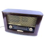 A vintage Bush radio, in a walnut case, type VHF.72, 48cm W.