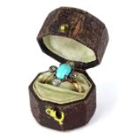 A Victorian dress ring, set with oval cut turquoise stone, and set with four old cut diamonds in