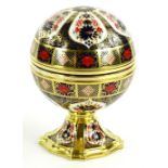 The Royal Crown Derby Millenium clock, decorated in Imari pattern, the hinged lid enclosing a clock,