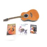 An Encore model Italian acoustic guitar, with guitar books, 105cm L.