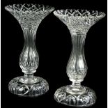 A pair of cut glass table lustres, each with inverted baluster shaped stem on a dome foot, lustres