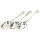 Three associated 19thC silver Old English pattern serving spoons, each engraved with a monogram, 5½