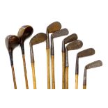 An associated set of hickory shafted golf clubs, to include two drivers, wedges, various makers