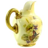 A Royal Worcester porcelain ewer, decorated with flowers, leaves and a butterfly