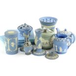 A collection of Wedgwood Jasperware, mainly blue but also a green Dudson tobacco jar decorated