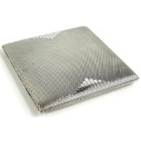 An Art Deco square silver cigarette case, with engine turned decoration, the interior named D P