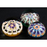 Three various Millefiore paperweights, each with stylised star decoration, unsigned.