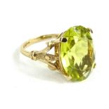 A 9ct gold and yellow quartz ring, oval cut, (AF- stone chipped and loose from frame), 5.5g all in.