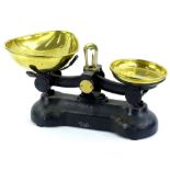 20thC table scale, with iron frame and removable brass dishes, 34cm W.