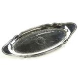 A George III silver pen tray, of shaped oval form, chased to the centre with a repeat banding and