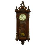 A Gustav Becker late 19th/early 20thC Vienna wall clock, the walnut case with a composite rearing