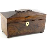 A mid 19thC rosewood sarcophagus shaped tea caddy, the hinged lid enclosing a later paper lined
