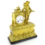 A late 19thC French gilt metal figural mantel clock, the enamel dial decorated with Roman