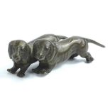 A pair of Austrian style bronze dachshunds, 7cm L.