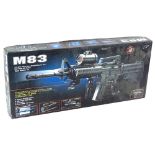 A M83 air soft electric gun, in original packaging.