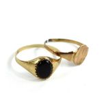 Two dress rings, to include a 9ct gold signet ring, set with black agate stone, 1.2g, and a 9ct gold