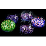 Five Millefiore paperweights, to include three similar examples in blue and purple.